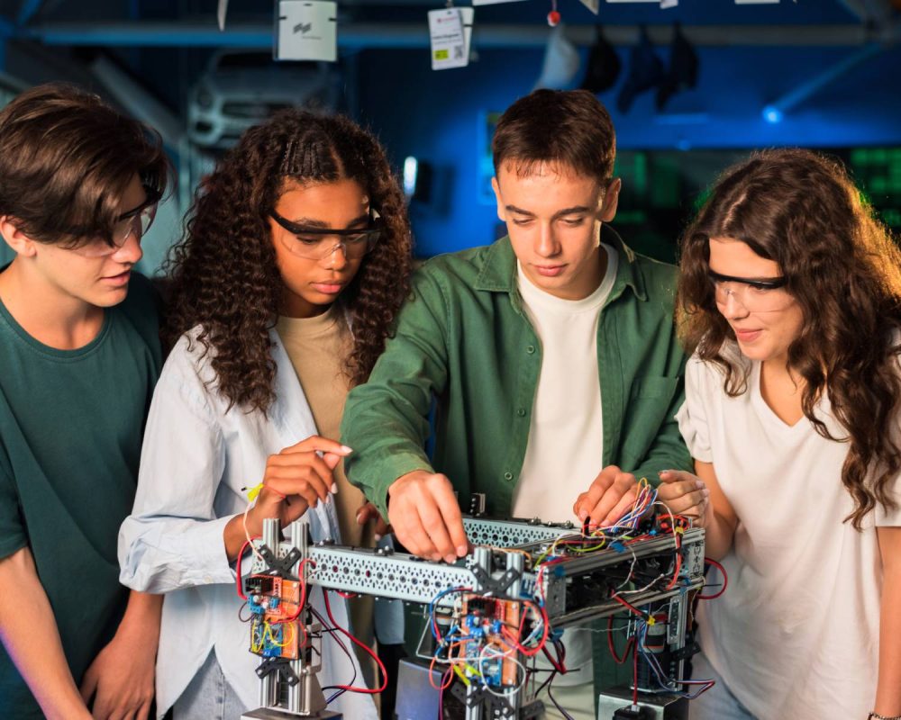 group-young-people-doing-experiments-robotics-laboratory-girls-protective-glasses(1)